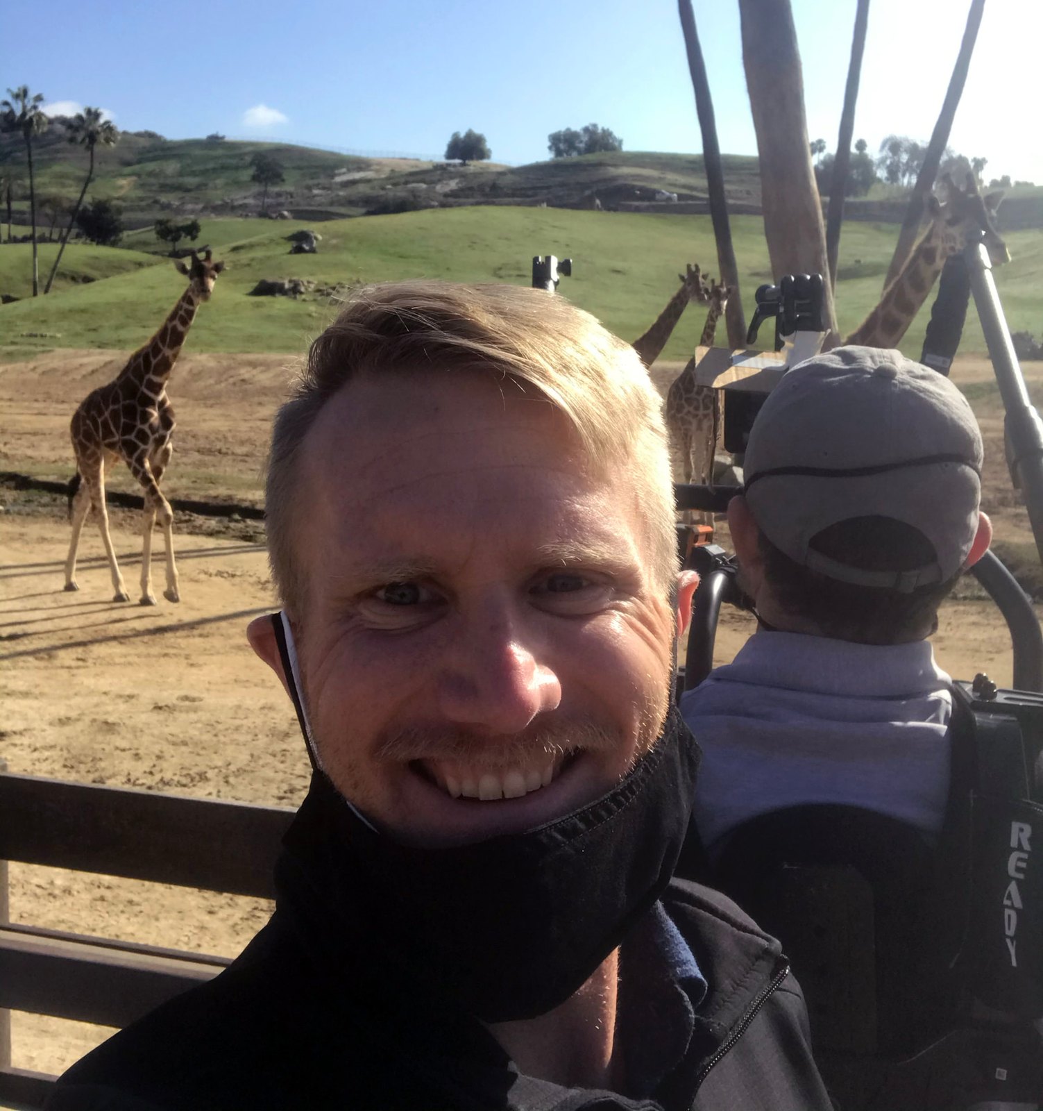 Aaron Pettijohn on location while filming giraffes at the San Diego Zoo